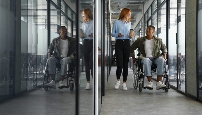 disabled-man-wheelchair-working-his-office-job